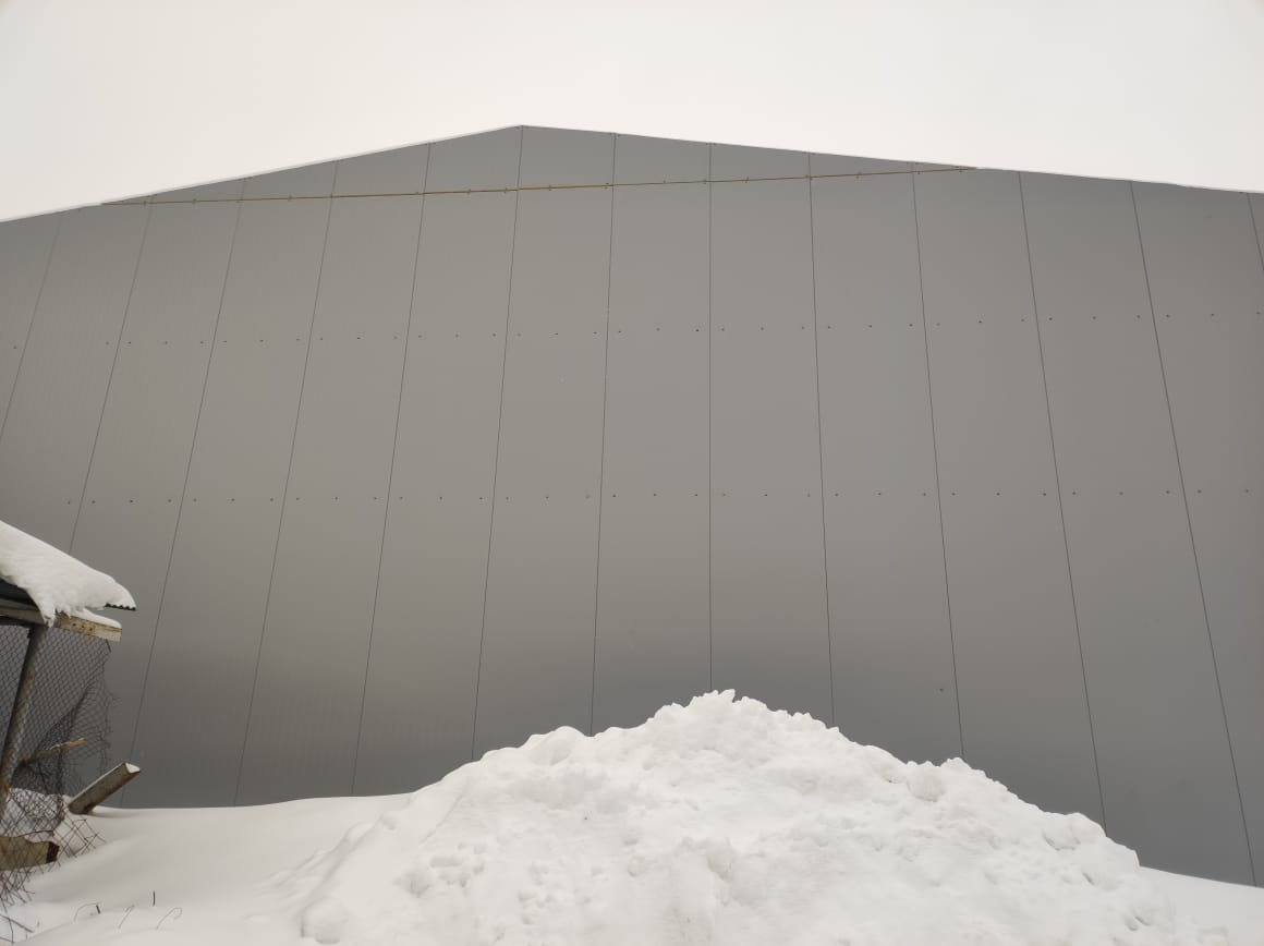 Работы по установке сэндвич-панелей на снс склад